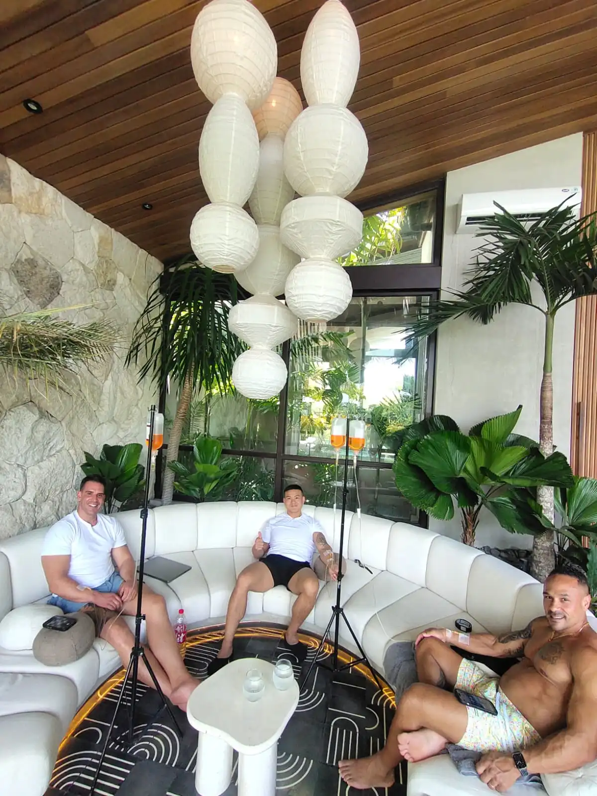 three guys chilling having iv drips