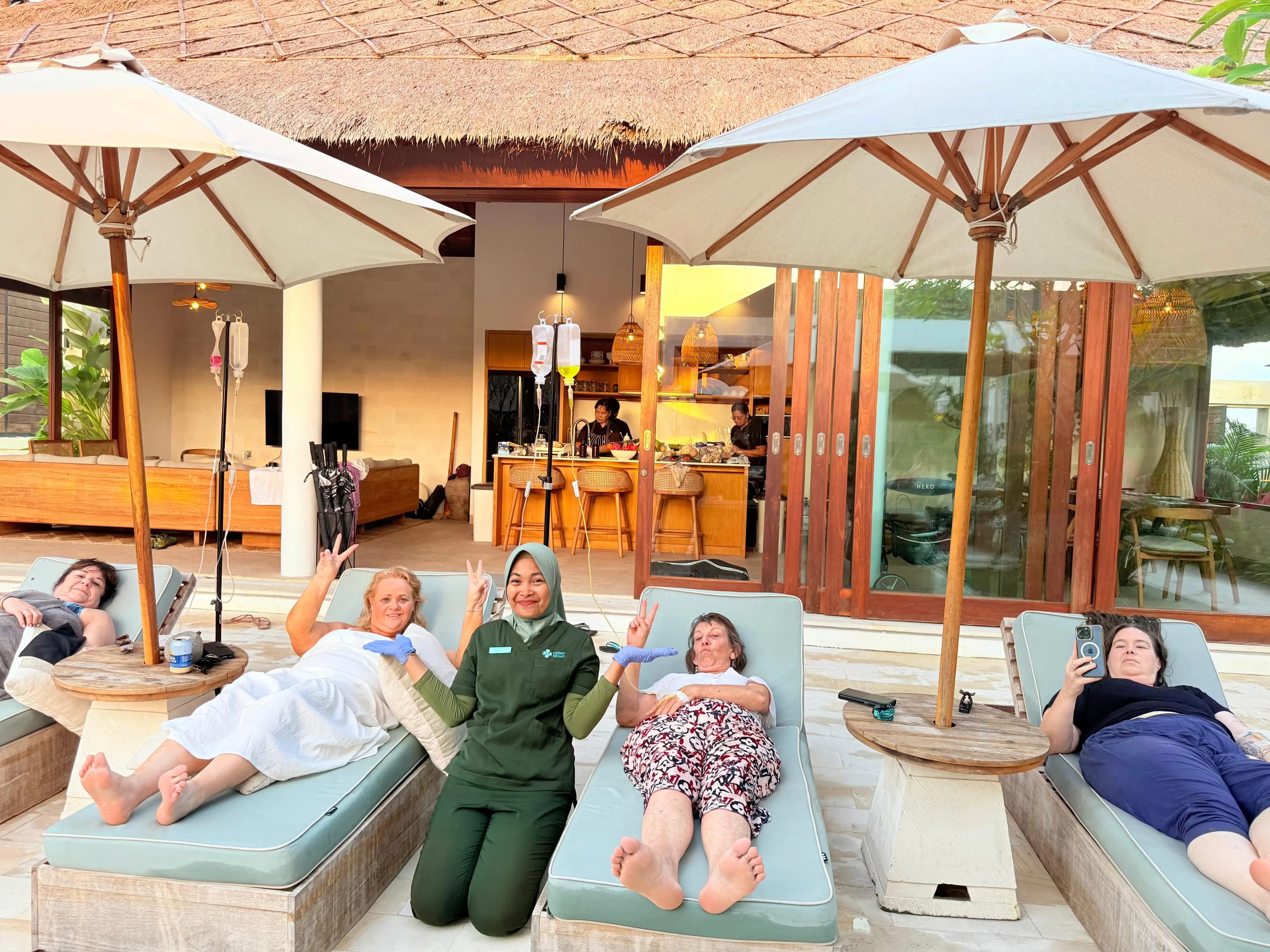 a family of 6 having iv drips by the pool side